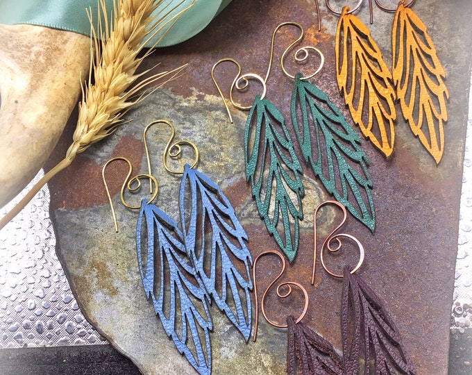 Light as a feather for Fall leather feather earrings with swirling ear wires, urban chic