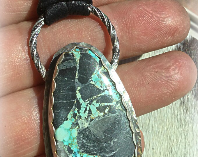 A river runs through it Blue Moon turquoise statement stone in simple silver setting with black soft Elk leather by Weathered Soul artisan