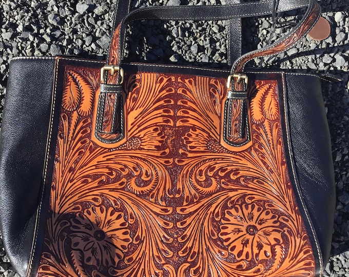 Leather embossed tooled bag over the arm straps, plenty roomy and very western from Weathered Soul