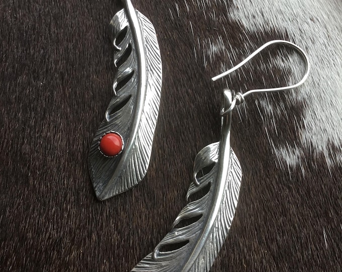 Beautiful long sterling detailed feathers with a touch of red jasper stones sterling ear wires, a lit Weight to them but not bad