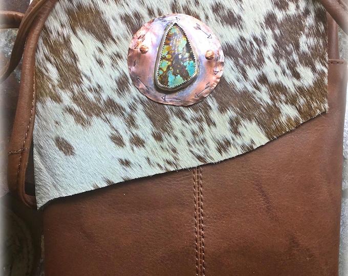 Sweet little Cowhide and turquoise stone crossbody bag by Weathered Soul, artisan hair on hide with lining and zipper pockets, long strap