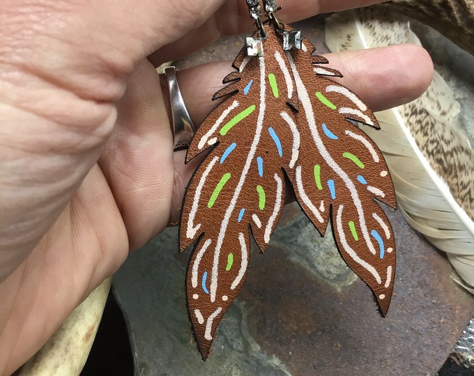 Rhinestones and hand painted leather funky feathers make these earrings stand out, eclectic style