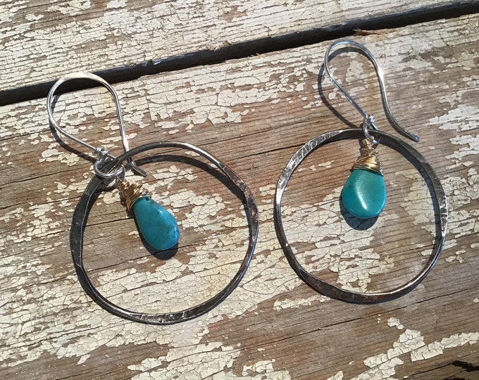 Back to the basics hammered hoops with real turquoise teardrop dangling from the center, Sundance style at far less price, quality, USA