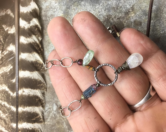 This necklace is so much prettier and Sundance looking than the picture shows such dainty details with gemstones , leather by weathered soul