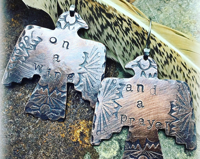 On a wing and a prayer earrings by Weathered Soul copper thunderbirds with sterling ear wires