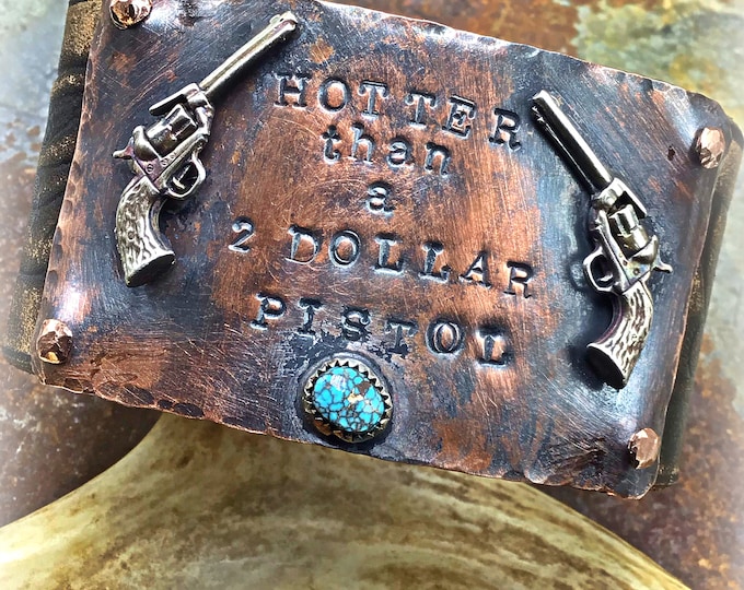 Hotter than a two dollar pistol rough and rowdy artisan made leather cuff with a touch of turquoise,western fashion