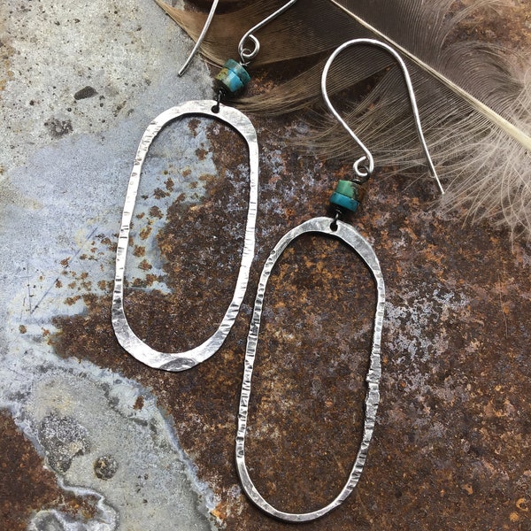 Back to the basics, simple but rustic oval hammered sterling hoops by Weathered Soul jewelry, a dab of turquoise at the top,Sundance style