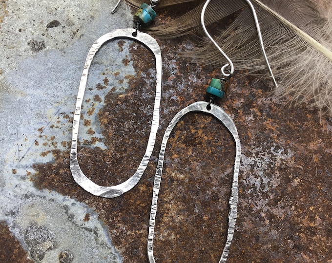 Back to the basics, simple but rustic oval hammered sterling hoops by Weathered Soul jewelry, a dab of turquoise at the top,Sundance style