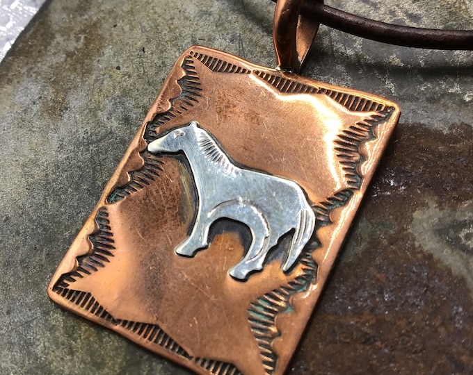 Simpleton pony in sterling on copper with Greek leather cord and longhorn button closure sets just a bit longer than a choker by collarbone