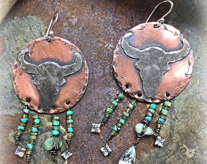 Absolutely stunning steer head statement earrings by Weathered Soul jewelry, turquoise peridot and rhinestones dangling beautifully below.