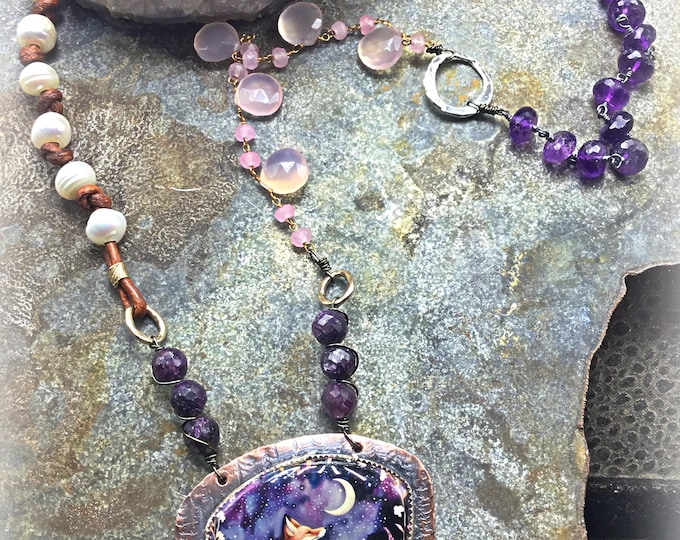 A whimsical evening necklace by Weathered Soul with large glass artisan made fox pendant and chalcedony,purple labradorite and amethyst.