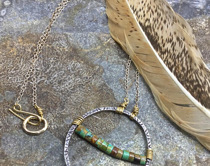 Infinity circle necklace in sterling silver with stamping and turquoise stones across with touches of bronze.Made to order!