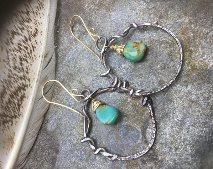 Very rustic heavy gauge hoops with beautiful turquoise teardrop centers wire wrapped in bronze with bronze ear wires by Weathered Soul