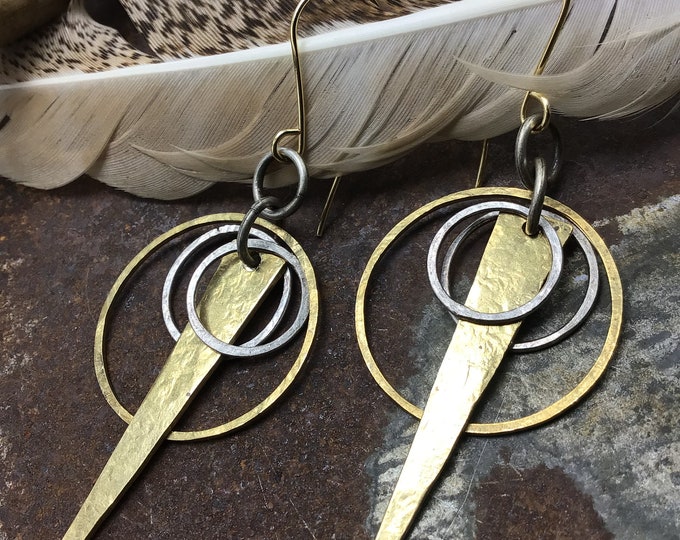 Fun rowdy hoops that look fantastic on by Weathered Soul Jewelry, bronze and silver entwined hoops