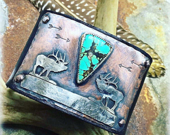 In rut cuff by Weathered Soul, two bugling elk calling for their cow, artisan crafted with stunning turquoise buffalo nickel snap closure