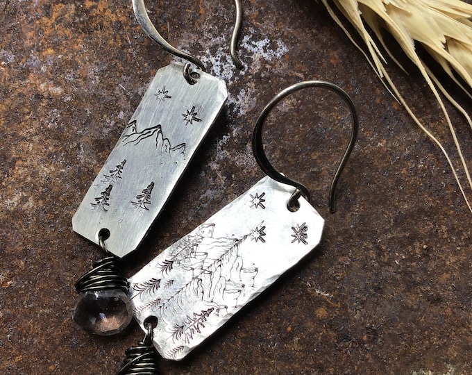 Dainty forest and mountain earrings with wire wrapped topaz and sterling ear wires approximately one inch long, simplistic design