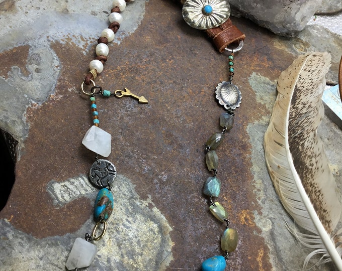 This necklace is absolutely stunning with moonstone,labradorite, bronze,turquoise and Sterling,with soft dark elk leather.