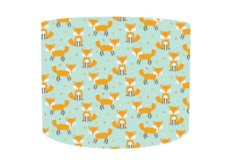 May include: A light blue lampshade with a repeating pattern of orange foxes on a light blue background.