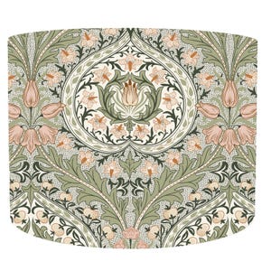 May include: A decorative floral pattern with stylized flowers and foliage in green, peach, and cream. The design includes a central heart-shaped motif and a repeating pattern of flowers and leaves.