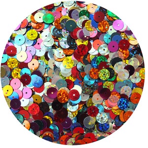 May include: A circular arrangement of colorful sequins in various sizes and shades, including red, pink, yellow, green, and blue. The sequins have a shiny, reflective surface and are scattered across the image, creating a vibrant and textured appearance.