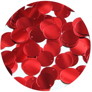 May include: A pile of red metallic sequins, ideal for crafting and embellishing projects.