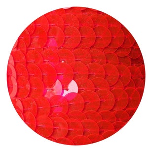 May include: Close-up of a red sequin fabric. The sequins are small and round, creating a shimmering effect.