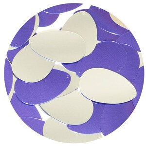 May include: A collection of silver and purple sequins in the shape of teardrops. The sequins are arranged in a circle.