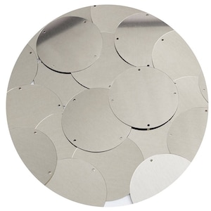 May include: A silver metallic wall art piece made of overlapping circles.