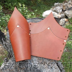 Leather Articulated Bracers in Chestnut Brown.