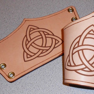 Leather engraved Bracers with a Celtic unity knot image