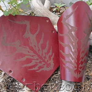 Leather Bracers with a Engraved Tribal Rib design image on Burgundy.