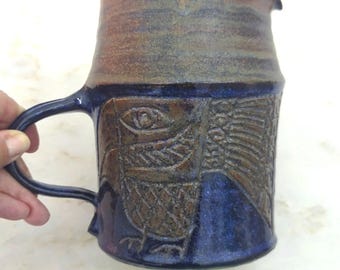 Handmade art pottery pitcher, cobalt blue & brown. Bird