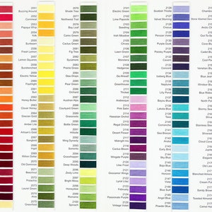 May include: A comprehensive colour chart displaying a wide range of thread shades. Each colour is identified by a number and name, spanning a spectrum from pinks and reds to greens, blues, and yellows, suitable for various craft applications.