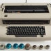 IBM Selectric II Golf ball vintage electric typewriter in original grey color with 8 extra type balls, Switzerland c. 1970 image 1