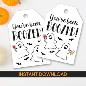 May include: Two white gift tags with the text "You've been BOOZED!" in black. The tags feature cartoon ghosts holding wine glasses and beer mugs, with black bat silhouettes. The bottom of the image reads "INSTANT DOWNLOAD".