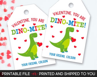 May include: Two printable Valentine's Day gift tags featuring a green dinosaur holding a red heart. The text on the tags reads "Valentine, You Are Dino-Mite!" and "Your Friend, Colson".
