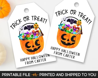 May include: Two white Halloween gift tags featuring a pumpkin basket design. The tags read "Trick or Treat!" and "Happy Halloween from Carter." The pumpkin basket is filled with sweets and Halloween decorations.