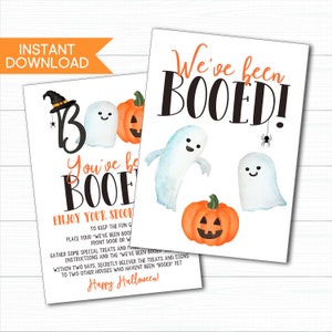 May include: Two Halloween-themed printable signs. One sign says "Boo" with a ghost, pumpkin, and witch hat. The other says "We've been BOOED!" with ghosts, a pumpkin, and a spider. The signs are for a Halloween game.