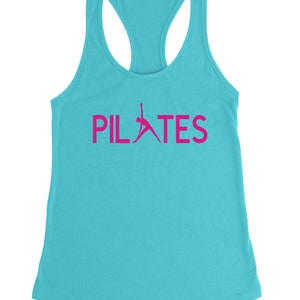 May include: A turquoise tank top with a pink silhouette of a person doing pilates and the word "PILATES" in pink letters.