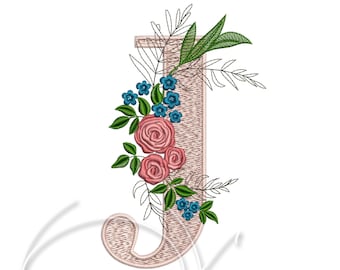 May include: Embroidered floral letter J with pink roses and blue flowers. The letter is a light pink colour and the flowers are surrounded by green leaves.