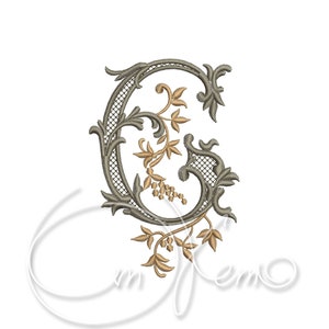 May include: A decorative embroidered letter G with a floral design. The letter is in a gray color and the flowers are in a gold color.