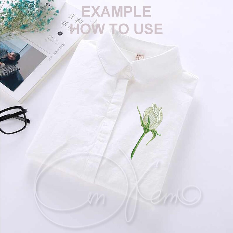 May include: White button-down shirt with a white rose embroidered on the front. The shirt has a collar and a single button closure. The text "EXAMPLE HOW TO USE" is printed on the shirt.