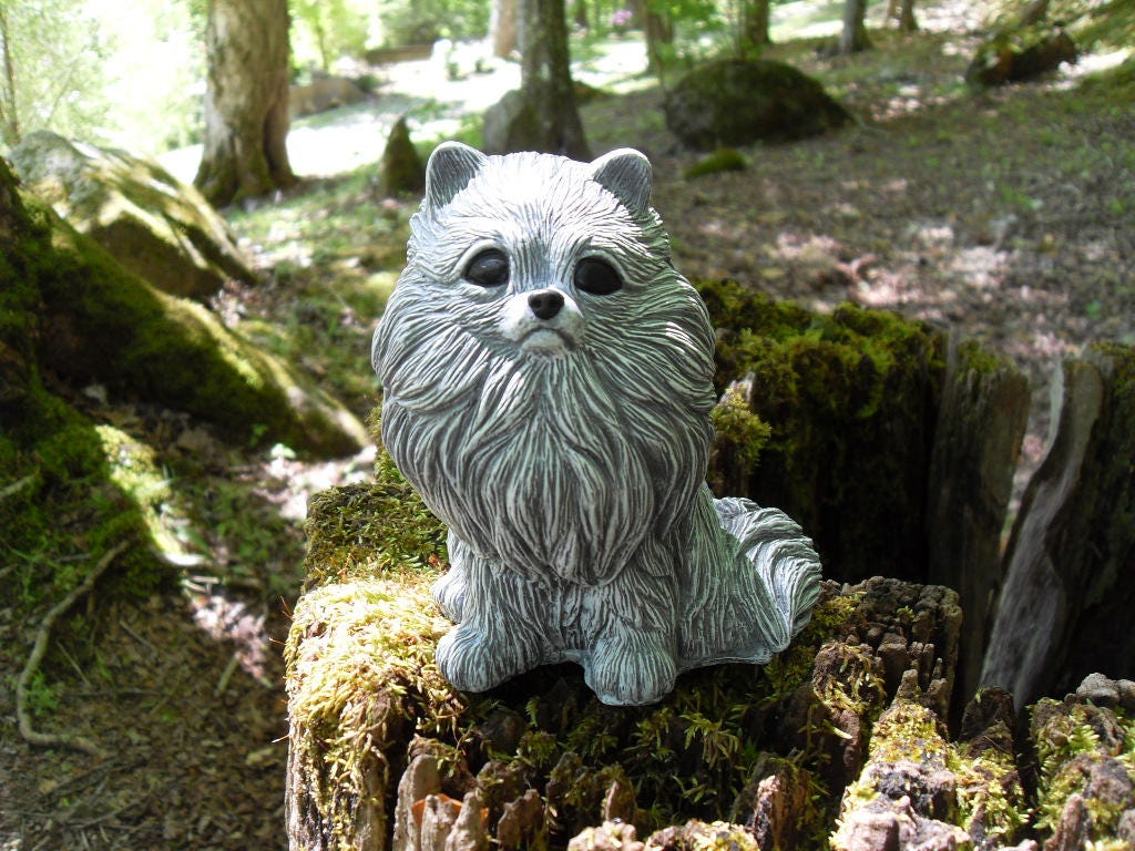 pomeranian statue with wings