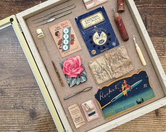 Vintage assemblage in Shadow box