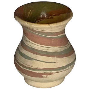 May include: A small, hand-thrown ceramic vase with a marbled glaze in shades of brown, green, and white.