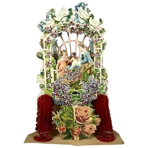 May include: A vintage paper diorama featuring a garden scene with children. The arched structure is adorned with flowers and vines, with a central window. Red honeycomb paper accents frame the base, and a bouquet of roses is at the bottom.