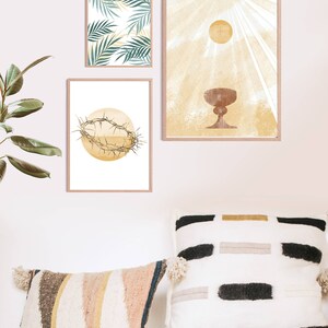 May include: Three framed prints with religious imagery. The first print features a crown of thorns, the second print features a chalice, and the third print features palm leaves.
