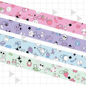 May include: Five rolls of colorful washi tape with different patterns. The patterns include a pink tape with cherries, a purple tape with ghosts, a blue tape with grapes, and a green tape with smiley faces.