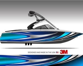 May include: A sleek, modern motorboat with a blue and silver wave design. The boat features a black tower and windshield, with the text "DESIGNED AND MADE IN THE USA" and the 3M logo.