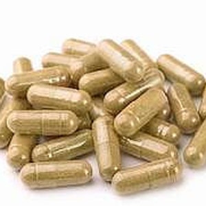 May include: A pile of light brown capsules, likely herbal supplements.